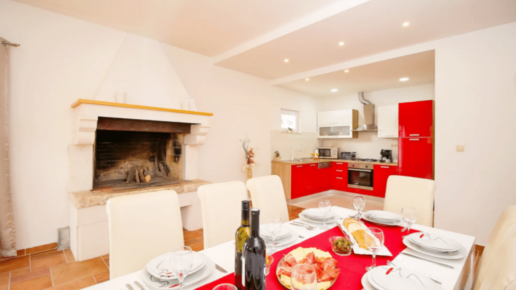 Bright kitchen and dining area with fireplace inside the private Croatia villa