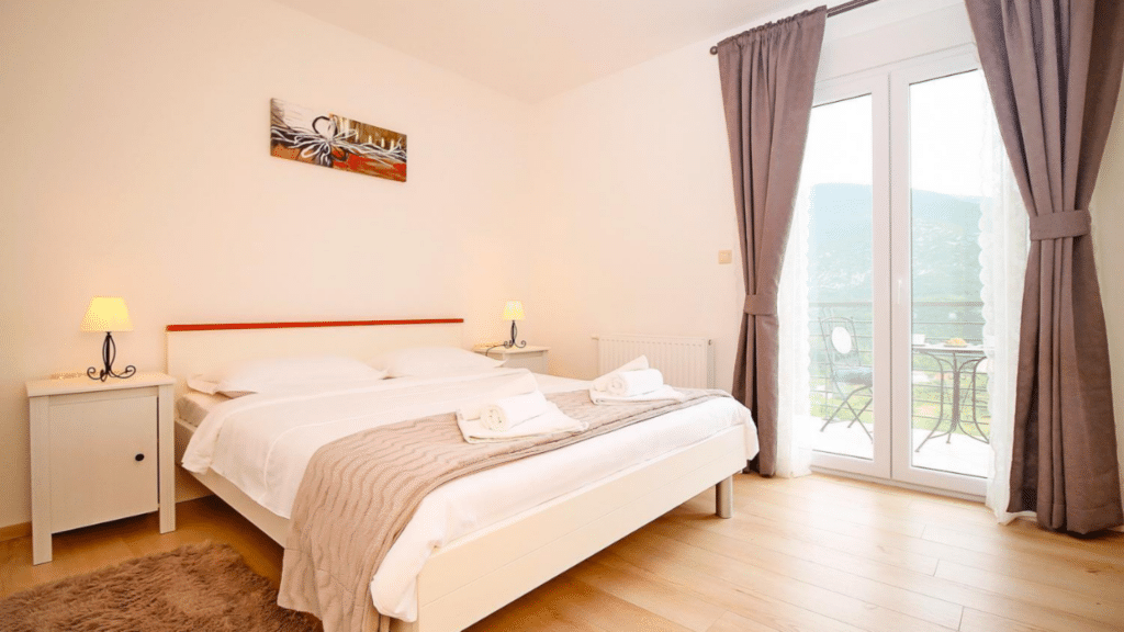 Double bedroom with balcony overlooking the Croatian countryside