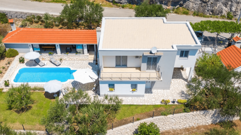 Aerial view of the private Croatia villa with pool and landscaped grounds in Omis