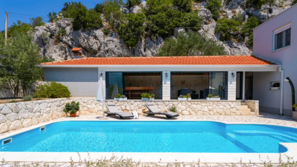 Private Croatia villa with pool and outdoor living area surrounded by mountains